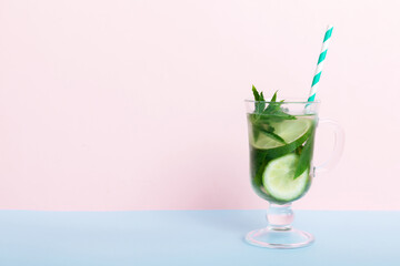 Mojito summer refreshing cocktail with ice and mint. mojito cocktail with lime, lemon and mint in a tall glass with a stick