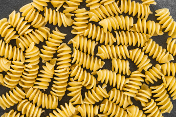 Uncooked eliche pasta isolated on white background with clipping path
