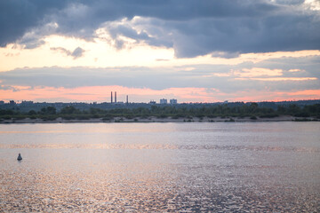 Fototapeta premium In the evening at sunset, beautiful nature with a river. Blue clouds.