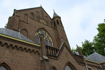 Fototapeta premium The front of the Holy Heartchurch in Oss city, North Brabant, the Netherlands, also known als het Flowerchurch.