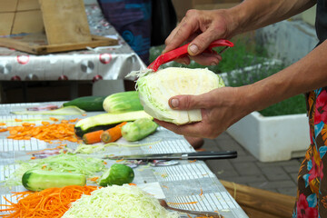 Cutting vegetables for salad. Master class cutting vegetables. Selective focus.