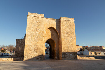 Ciudad Real, Spain. The Puerta de Toledo (Toledo Gate), a Gothic fortified city entrance formerly part of the walls. Horseshoe arch - obrazy, fototapety, plakaty