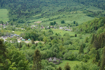 Fototapeta na wymiar View of a village with small houses in the Carpathian mountains.