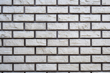 Texture brick white and dark gray seams, stone masonry light. Facade tile