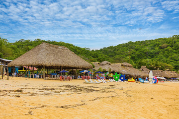 Huatulco bays -  Maguey beach. Beautiful beach with pristine waters, with turtles and fishes. Mexican beach with wooden huts by the sea