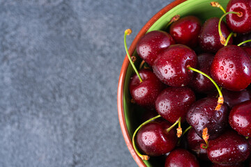 Ripe cherries in porcelain bowl