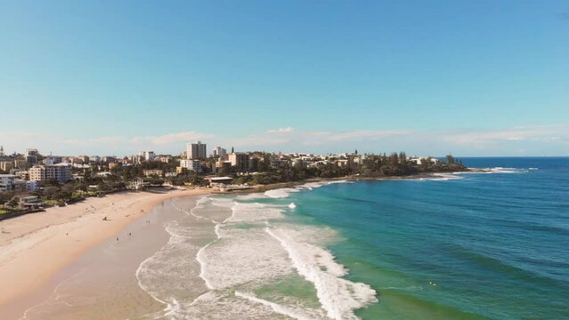 Aerial view of Kings Beach coastline at Sunshine Coast, Queensland on a beautiful, bright blue sky day. 