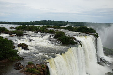 The photo shows a stunning view from the top of the Iguazu Falls — a complex of 275 waterfalls on the Iguazu River, located on the border of Brazil and Argentina.