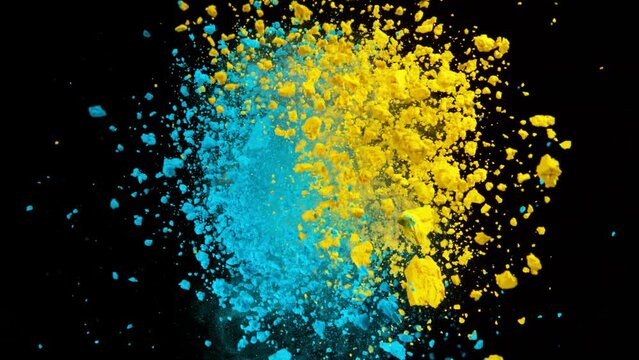 Super Slow Motion Shot of Yellow and Blue Color Powder Expolosion on Black Background at 1000fps.