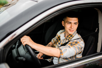 Young guy driving a car