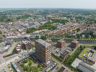 Fototapeta na wymiar Purmerend urban city in north holland the Netherlands Holland, aerial drone overhead overview. City center summer sunny day. River buildings roads.