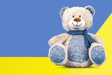 World Down Syndrome Day background. Down syndrome awareness symbol. Teddy bear on yellow and blue...