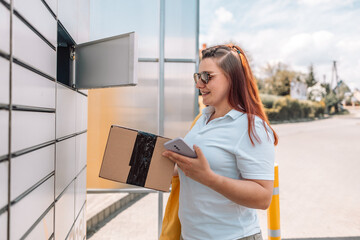 Caucasian woman picks up mail from automated self-service post terminal machine. Mail shipping...