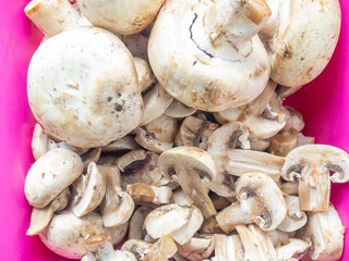 Lots of chopped mushrooms. Cooking dishes with mushrooms. Raw chopped mushrooms.  Unprepared product.