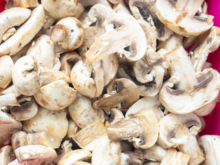 Lots of chopped mushrooms. Cooking dishes with mushrooms. Raw chopped mushrooms.  Unprepared product.