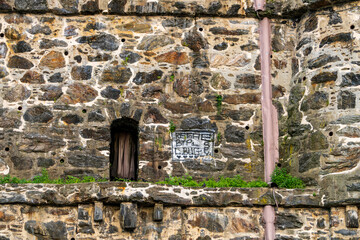 Fototapeta premium A curious door in the side of a wall that looks down on the Henry Hudson River Parkway. 