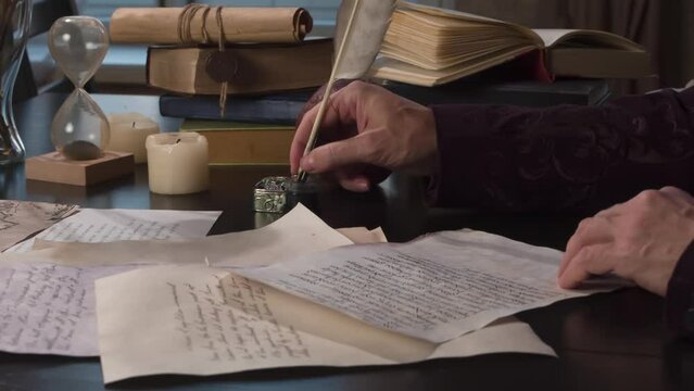 Writer Rereads and Appends the Manuscript. Medieval writer rereads text on a sheet of old paper and appends with a pen at the bottom a few lines