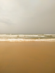 Beautiful soft wave sea on the sandy beach in summer