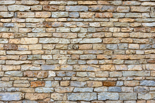 Slate, stone and brick wall texture background of the building or fence
