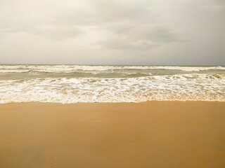 Beautiful wave on the sand beach background