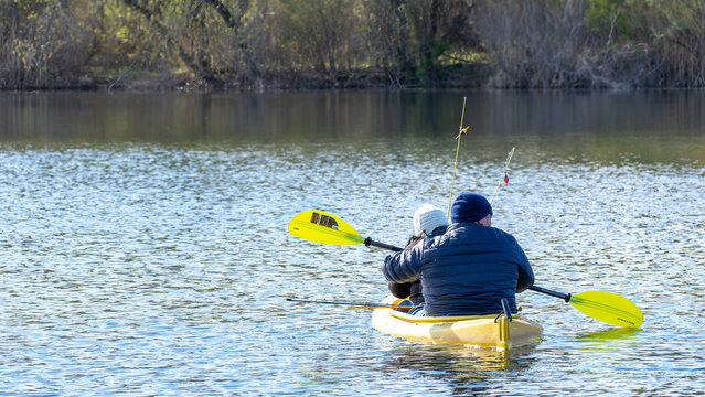 Man and woman fishing in a two-person kayak, Michigan
