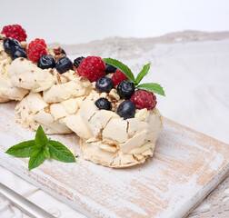 Baked cake made from whipped chicken protein and cream, decorated with fresh berries