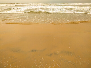 A beautiful wave on the sand beach