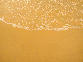 Clean fine sand beach and white wave background, summer concept background