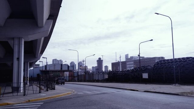 Street under a Freeway Overpass in La Boca District, Buenos Aires, Argentina. 4K Resolution.