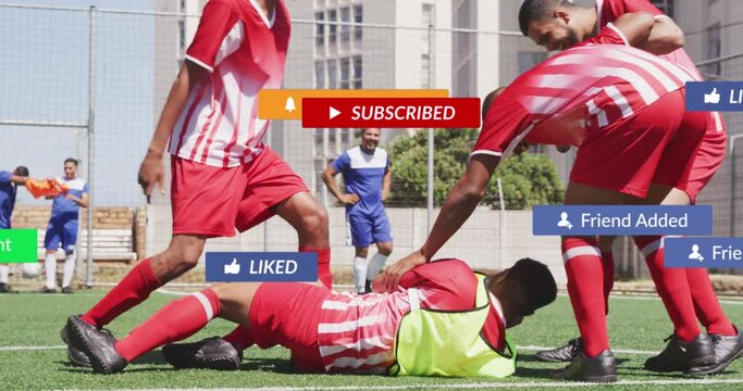Social media concept icons against injured male soccer players on sports field