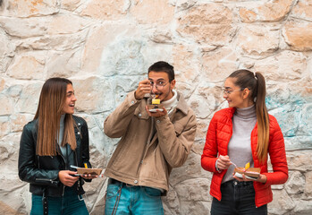 A group of students takes a break from college to rest and talk and eat delicious sweets.Selective focus. High quality photo