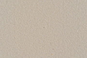Beige color cardboard recycled paper, seamless tileable texture, image width 20cm