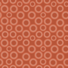 Sienna rust geometric circle repeat pattern with the smaller circles creating larger ones in this background pattern of sienna, rust, peach, coral and beige colors.