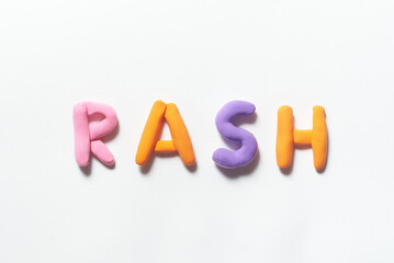 Rash word formed of colored plasticine.