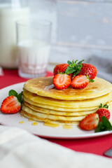 American Pancakes with strawberries and honey