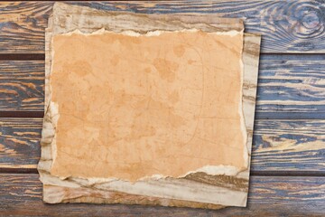 Inspirational handmade paper against rustic weathered wood, storytelling and narration concept.