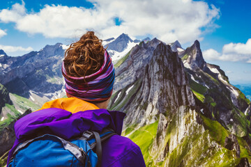 Hiker is enjoying the view from a beautiful viewpoint in the Säntis massive