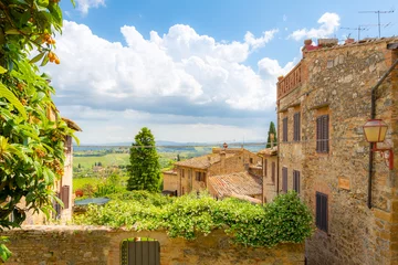 Peel and stick wall murals Toscane View of the hills and Tuscan countryside over the medieval hilltop village of San Gimignano, Italy.