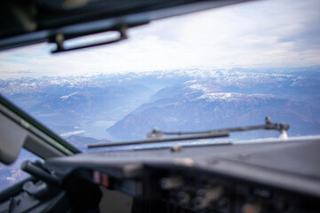 Fototapeta na wymiar airplane in flight over alps