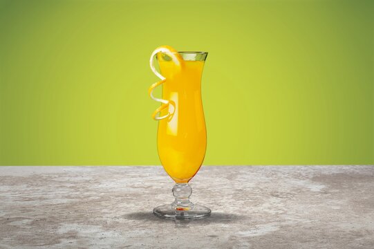 Orange Juice on a color background, in bright light. Glass of Juice with blended orange. Summer tropical cocktail.