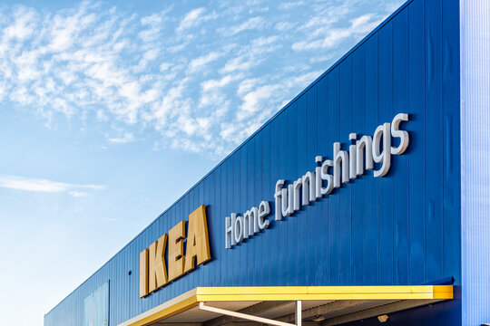 Jacksonville, USA - October 19, 2021: Sign on large blue building for IKEA home furnishings furniture warehouse center store with bright colorful blue and yellow in Florida