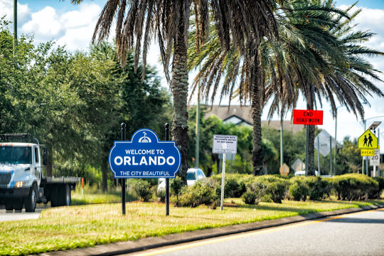 Orlando, USA - October 19, 2021: Billboard sign of Welcome to Orlando, Florida the city beautiful roadside blue board entrance to tropical tourist resort in Orange county