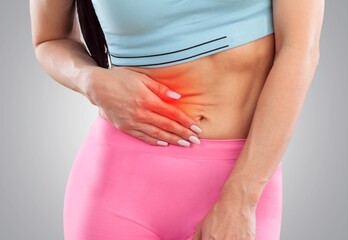 Woman with stomach pain causes of abdominal pain include inflammatory bowel disease. stomach ulcer...