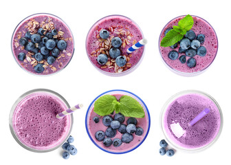 Set with delicious blueberry smoothies on white background, top view