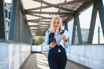 Portrait of a business woman using a cell phone