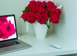 bouquet of roses and computer