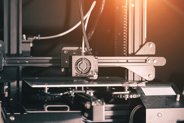 3D printing machine, 3D printer prints a new model - obrazy, fototapety, plakaty