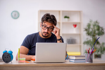 Young male designer working in the office