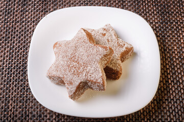delicious chocolate flavor cookie sprinkled with sugar late night snack placed on a white plate homemade