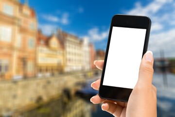 Hands holding smartphone with blank screen